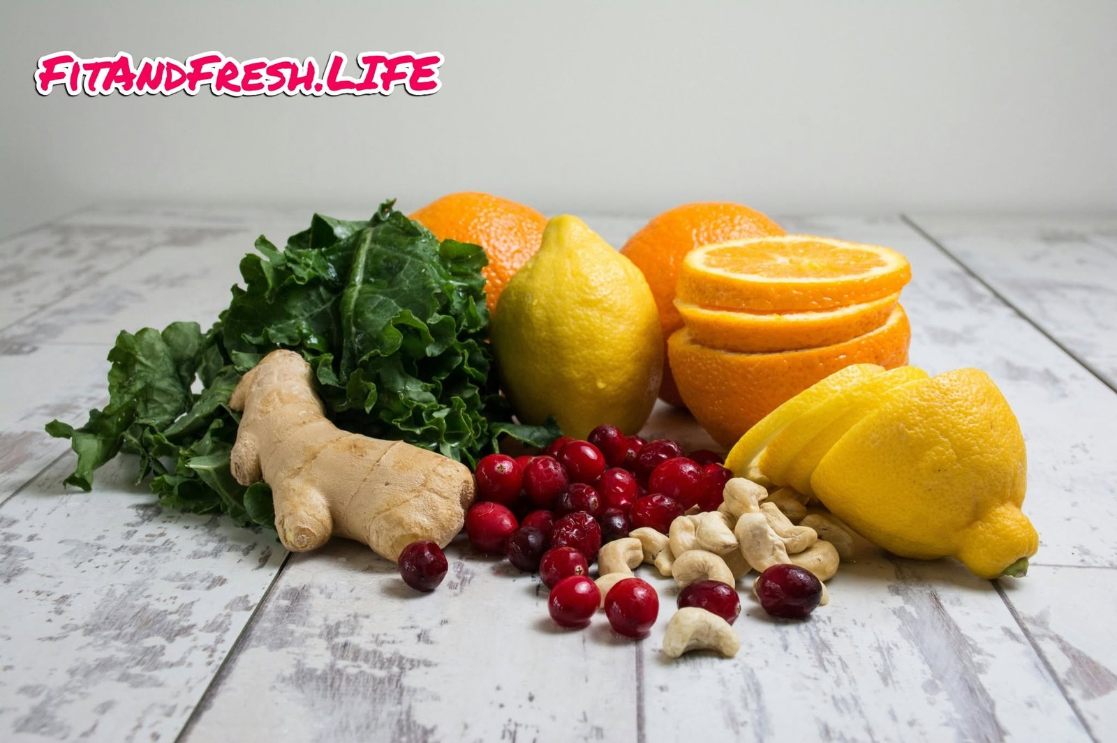 A variety of natural immunity-boosting superfoods including citrus fruits, green tea, garlic, berries, leafy greens, carrots, and nuts rich in antioxidants, vitamins, and minerals